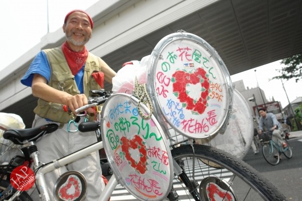 Cheerful cycling man with gay smile, his name is Captain flower (3)